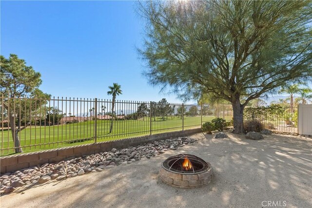 view of patio / terrace with a fire pit