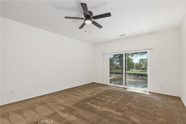 carpeted empty room with ceiling fan