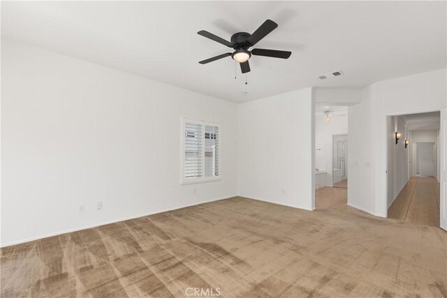 carpeted empty room with ceiling fan