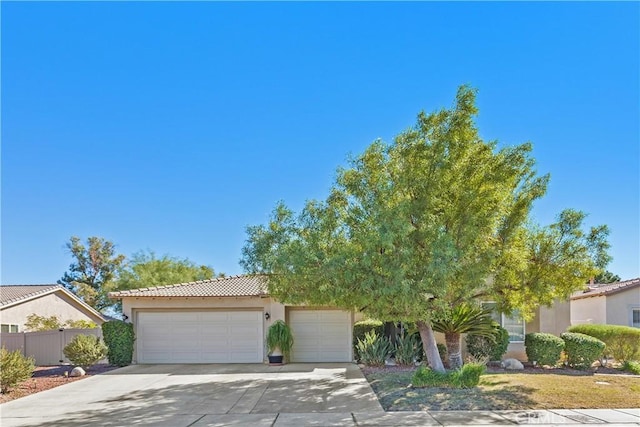 obstructed view of property featuring a garage