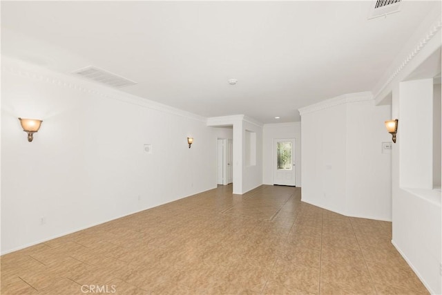 spare room featuring crown molding