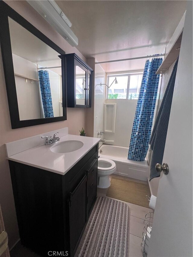 full bathroom featuring tile patterned flooring, shower / bath combination with curtain, toilet, and vanity