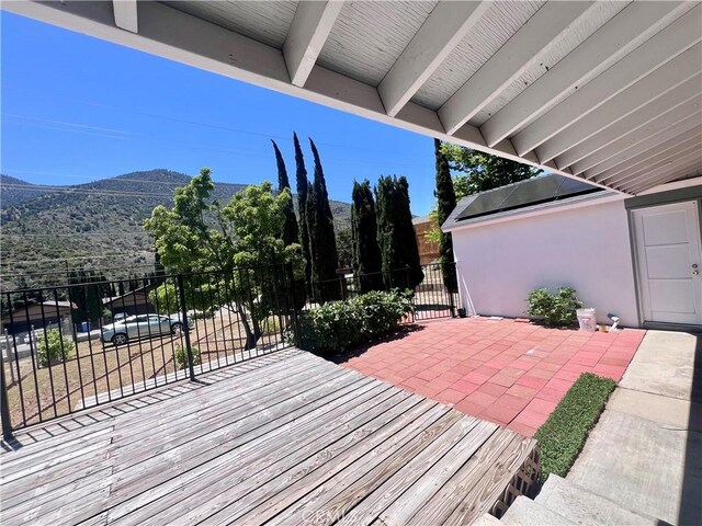 wooden terrace featuring a mountain view