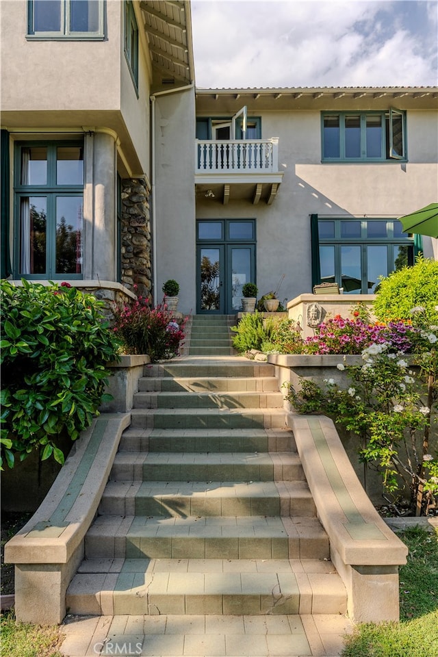 view of exterior entry featuring french doors