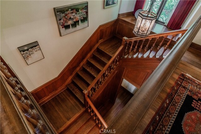 stairway featuring hardwood / wood-style flooring