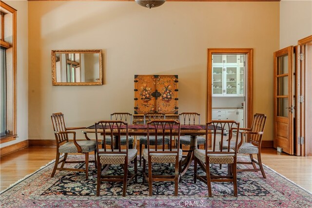 dining space featuring light hardwood / wood-style floors and a healthy amount of sunlight