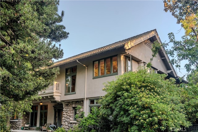 view of property exterior featuring a balcony