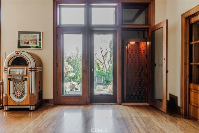 entryway with light hardwood / wood-style flooring