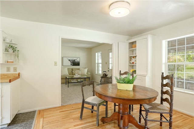 dining room with light hardwood / wood-style floors