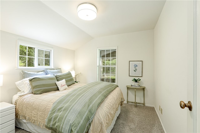 carpeted bedroom with vaulted ceiling