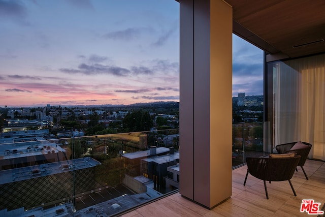 view of balcony at dusk