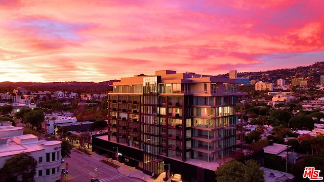 view of outdoor building at dusk