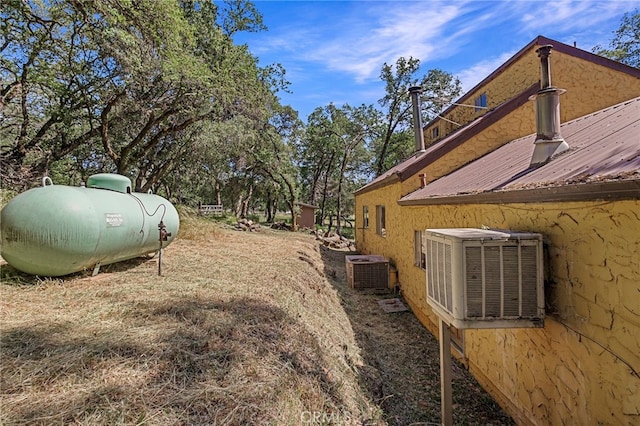 view of yard featuring central AC unit