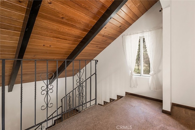 bonus room featuring vaulted ceiling with beams, carpet flooring, and wooden ceiling