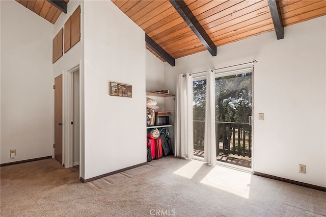 interior space with light carpet, wood ceiling, beam ceiling, and high vaulted ceiling