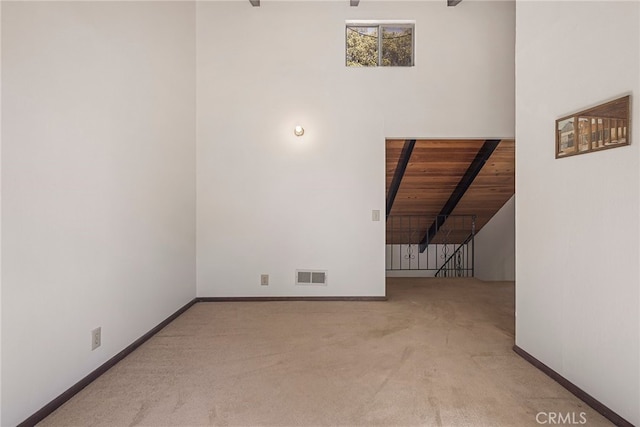 interior space with beam ceiling and wood ceiling