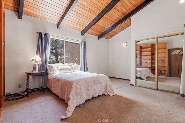 carpeted bedroom with beam ceiling, high vaulted ceiling, a closet, and wooden ceiling