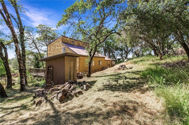 view of yard featuring a wooden deck
