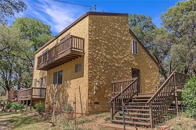 view of property exterior featuring a balcony