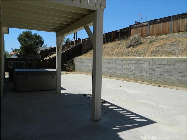 view of patio featuring a hot tub