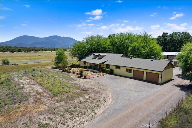 exterior space with a mountain view and a rural view