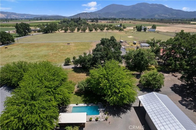 drone / aerial view with a mountain view and a rural view