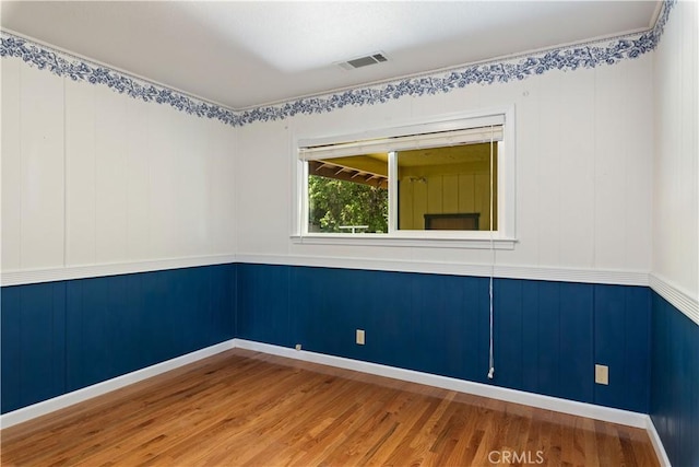 spare room featuring hardwood / wood-style floors