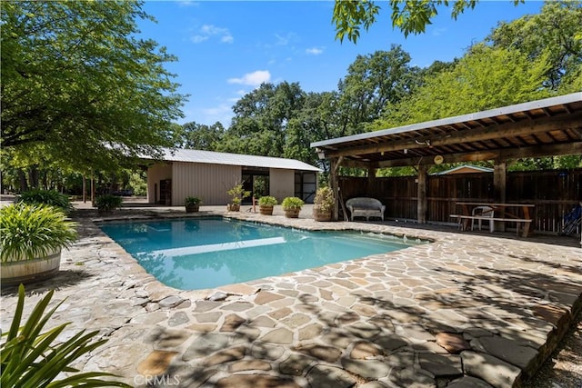 view of pool featuring a patio area