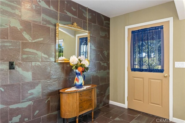 entryway featuring tile walls