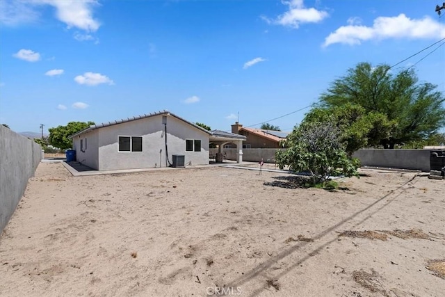 back of property with central air condition unit