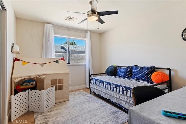 bedroom featuring wood-type flooring and ceiling fan