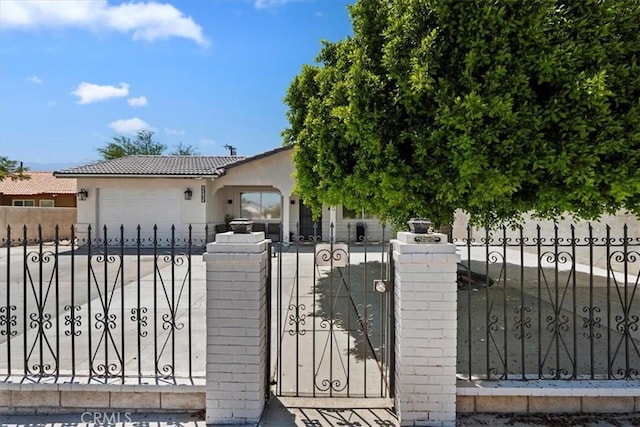 view of gate featuring a garage