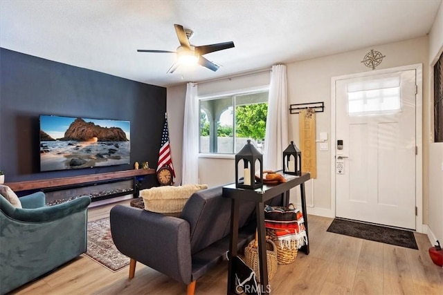 interior space featuring ceiling fan and light wood-type flooring