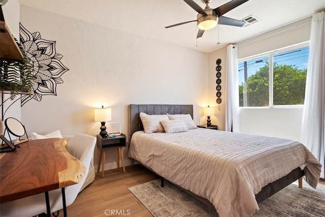 bedroom featuring ceiling fan and light hardwood / wood-style floors