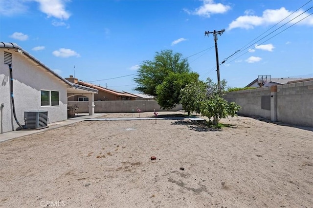 view of yard featuring central AC