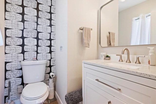 bathroom with vanity and toilet