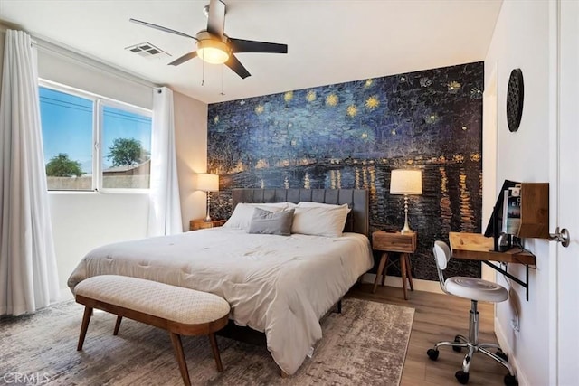 bedroom featuring ceiling fan and wood-type flooring