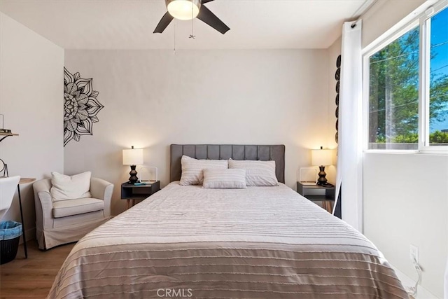 bedroom featuring ceiling fan and wood-type flooring