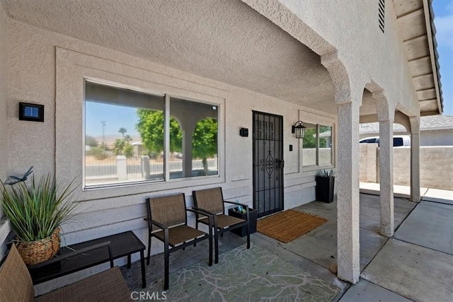 entrance to property with a patio