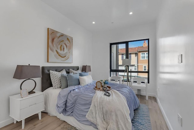 bedroom with light hardwood / wood-style floors