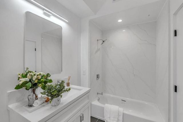 bathroom with washtub / shower combination and vanity