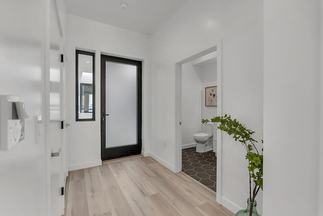 foyer with light hardwood / wood-style floors