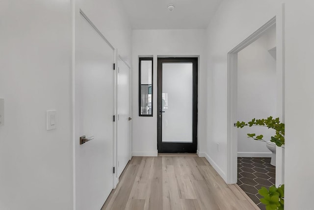 corridor featuring light hardwood / wood-style floors