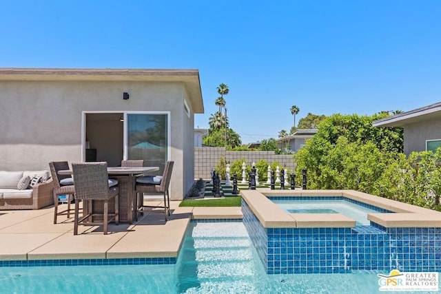 view of swimming pool with a patio area and an in ground hot tub