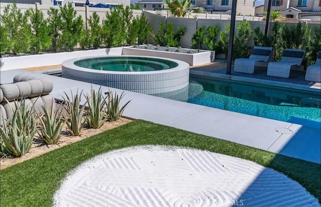 view of swimming pool featuring an in ground hot tub