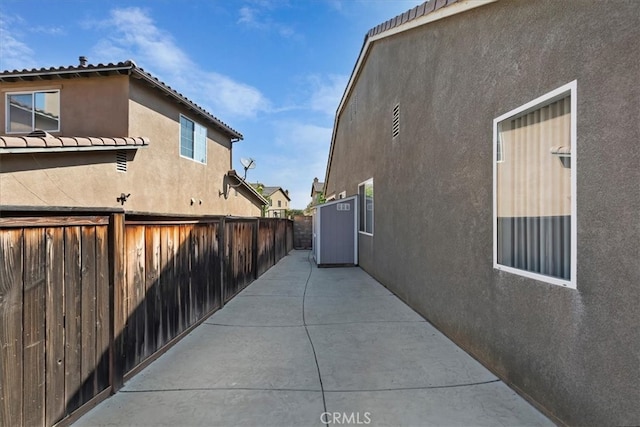 view of side of property with a patio