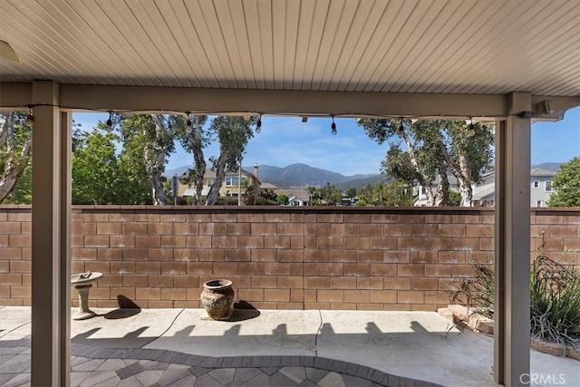 details with a mountain view and concrete floors