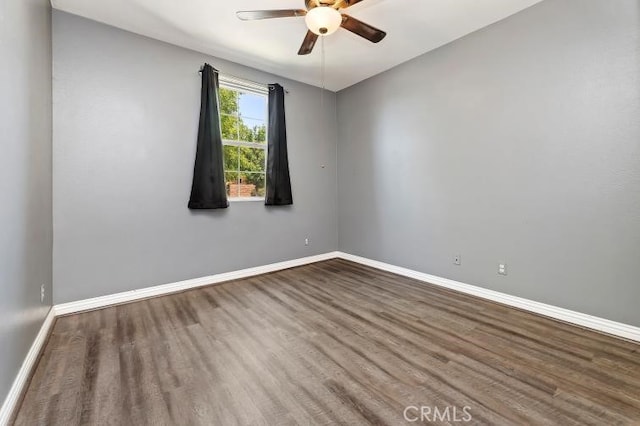 unfurnished room featuring hardwood / wood-style floors and ceiling fan