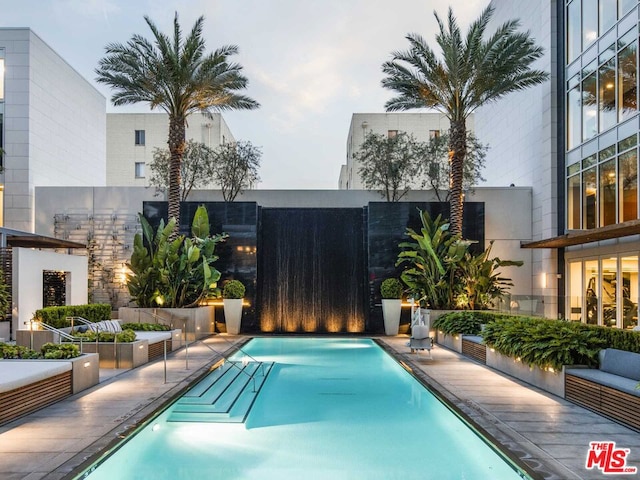 view of pool featuring a patio