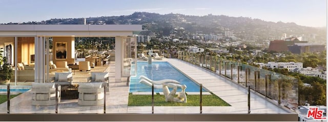 view of swimming pool featuring a water slide and a patio